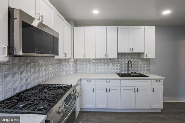 604 E 31st St, Baltimore, MD 21218 - kitchen featuring stainless steel appliances, light countertops, white cabinets, and recessed lighting