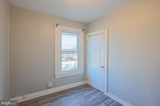 604 E 31st St, Baltimore, MD 21218 - empty room with baseboards and wood finished floors