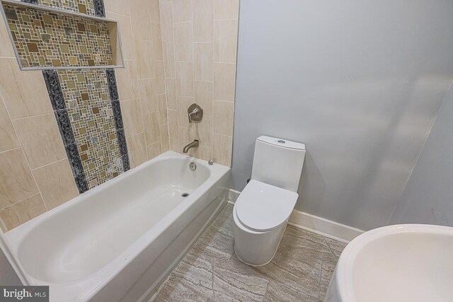 604 E 31st St, Baltimore, MD 21218 - full bathroom featuring toilet and shower / bath combination