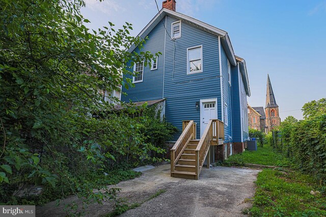 604 E 31st St, Baltimore, MD 21218 - rear view of house with a chimney