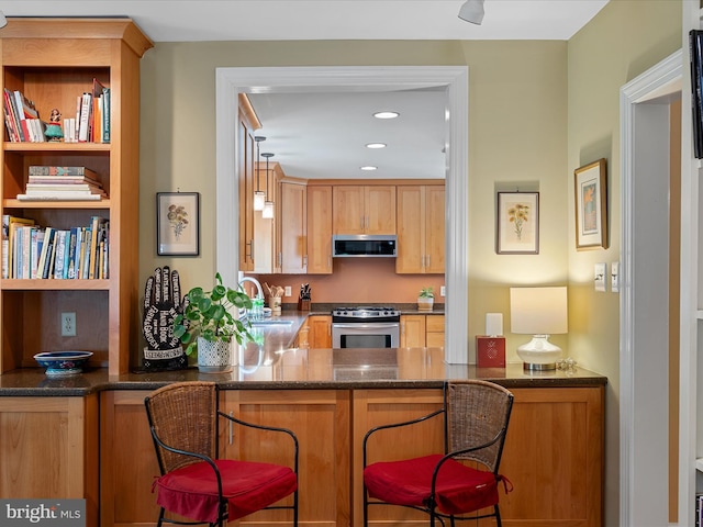 101 Morgan St, Winchester, VA 22601 - kitchen featuring stainless steel appliances, dark stone countertops, and recessed lighting