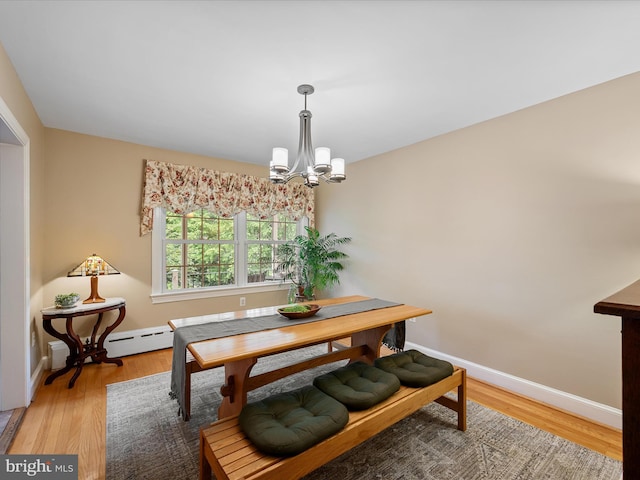101 Morgan St, Winchester, VA 22601 - dining space with a chandelier, light wood-style flooring, and baseboard heating