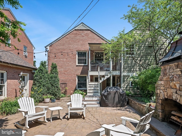 101 Morgan St, Winchester, VA 22601 - back of property with stairs, a patio area, and brick siding
