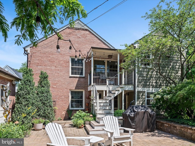 101 Morgan St, Winchester, VA 22601 - back of house featuring stairs, brick siding, and a patio area