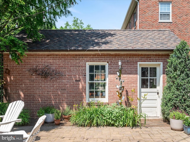 101 Morgan St, Winchester, VA 22601 - rear view of property featuring brick siding and a shingled roof