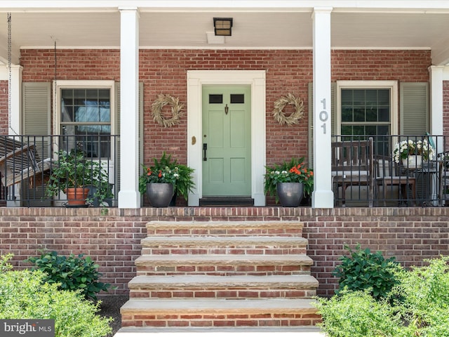 101 Morgan St, Winchester, VA 22601 - property entrance featuring a porch and brick siding
