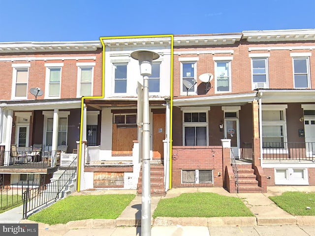 1712 Homestead St, Baltimore, MD 21218 - view of property featuring brick siding and a porch