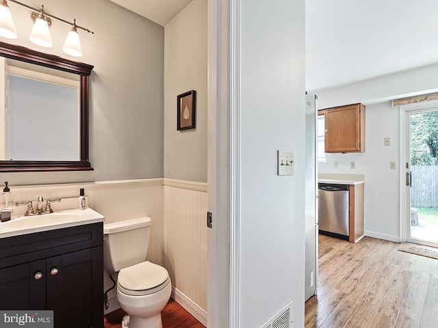 1035 Deerfield Cir, Perkasie, PA 18944 - bathroom with wood finished floors, a wainscoted wall, and vanity