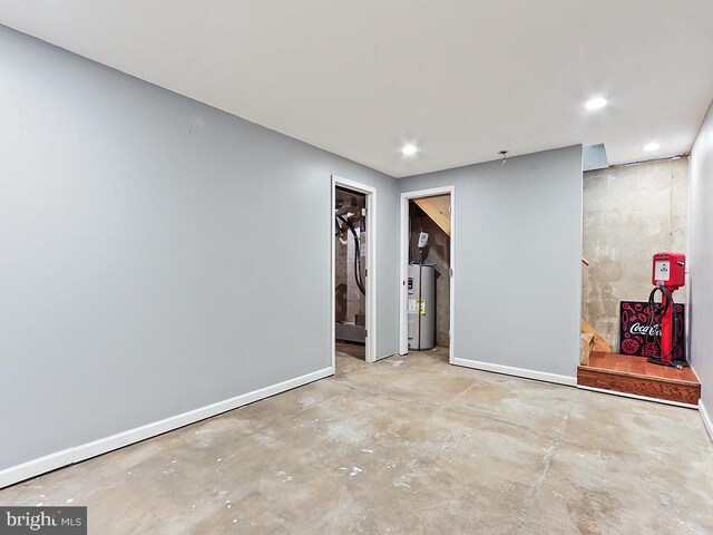 1035 Deerfield Cir, Perkasie, PA 18944 - empty room with water heater, concrete floors, and recessed lighting