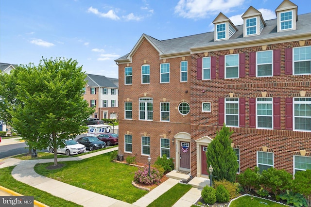 25672 Azalea Garden Ter, Aldie, VA 20105 - view of front of property with brick siding and a front lawn