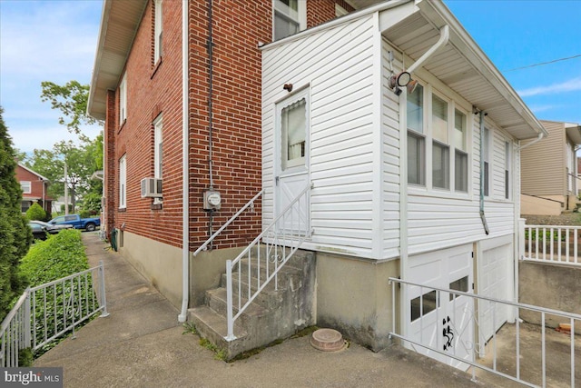 116 Chestnut St, Reading, PA 19607 - view of property exterior featuring a garage, brick siding, and entry steps