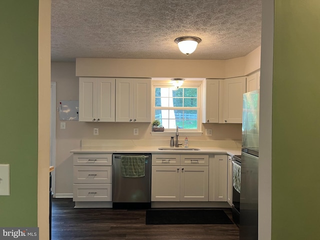 35904 Army Navy Dr, Mechanicsville, MD 20659 - kitchen with stainless steel dishwasher, a textured ceiling, white cabinetry, dark wood finished floors, and light countertops