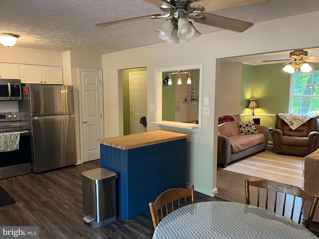 35904 Army Navy Dr, Mechanicsville, MD 20659 - kitchen featuring appliances with stainless steel finishes, ceiling fan, butcher block counters, white cabinetry, and dark wood-type flooring