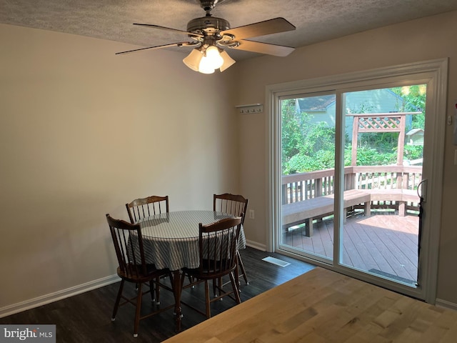 35904 Army Navy Dr, Mechanicsville, MD 20659 - dining room featuring dark wood-style floors, ceiling fan, and a textured ceiling