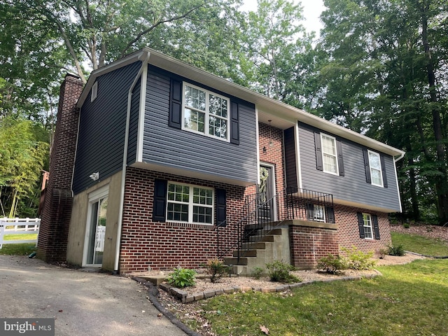 35904 Army Navy Dr, Mechanicsville, MD 20659 - split foyer home featuring brick siding and a chimney
