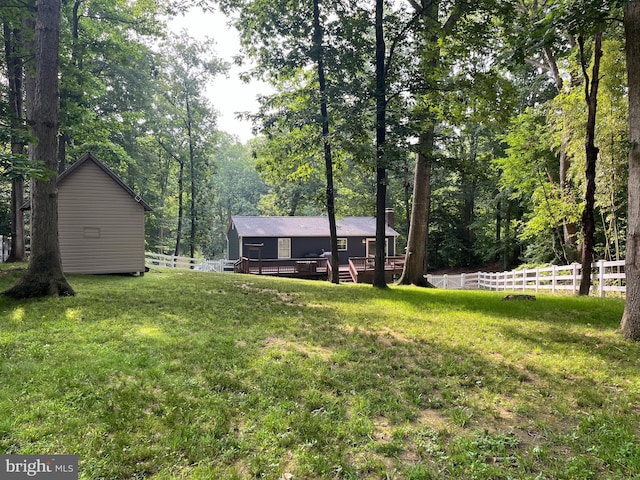 35904 Army Navy Dr, Mechanicsville, MD 20659 - view of yard with a wooden deck and a forest view