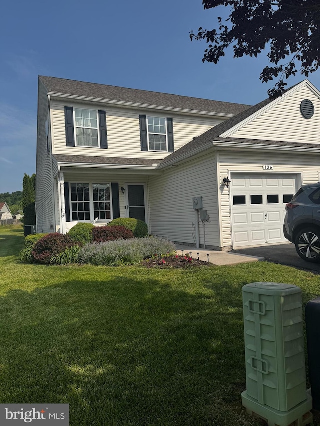 136 Cedarfield Dr, Gettysburg, PA 17325 - traditional-style home with a garage, a front yard, and asphalt driveway