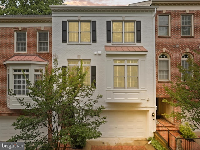 1473 Northern Neck Dr, Vienna, VA 22182 - colonial home with a garage, a standing seam roof, and brick siding