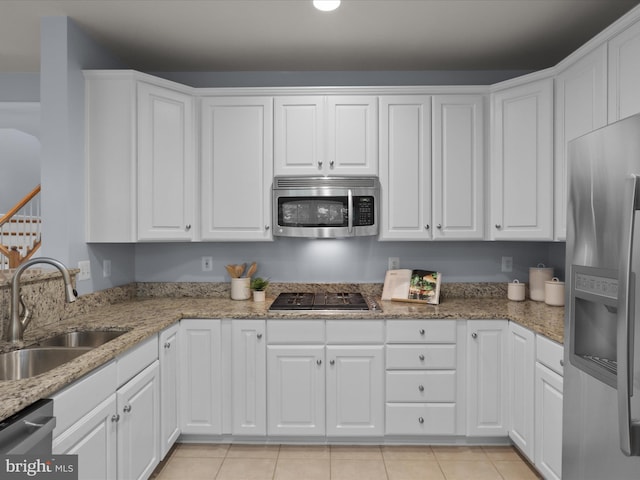 1473 Northern Neck Dr, Vienna, VA 22182 - kitchen with appliances with stainless steel finishes, white cabinetry, light stone countertops, and recessed lighting