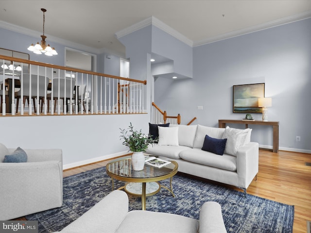 1473 Northern Neck Dr, Vienna, VA 22182 - living room with ornamental molding, a chandelier, wood finished floors, and stairway