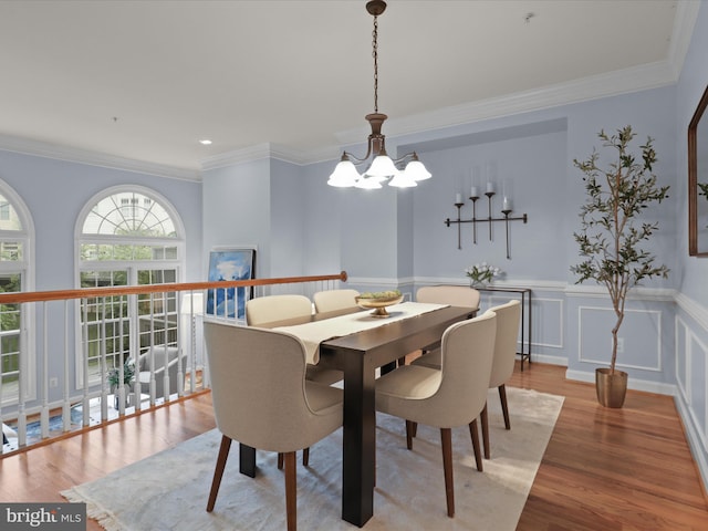1473 Northern Neck Dr, Vienna, VA 22182 - dining space featuring a chandelier, wood finished floors, wainscoting, and crown molding