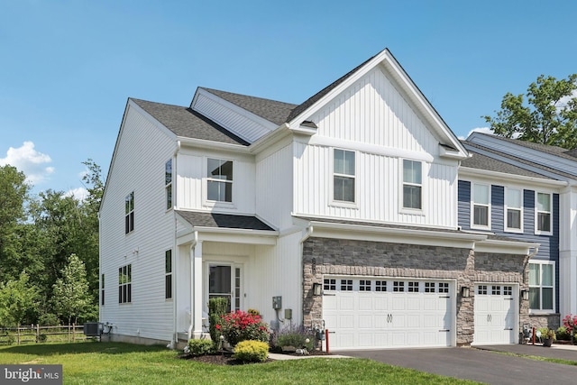 213 Wynstone Ct, Colmar, PA 18915 - multi unit property featuring stone siding, an attached garage, asphalt driveway, and a shingled roof
