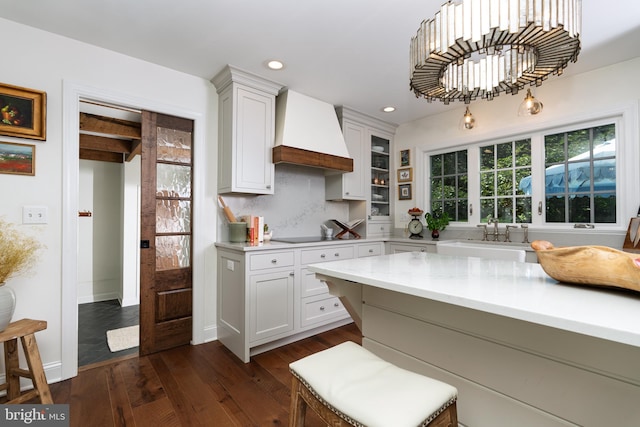1032 N New St, West Chester, PA 19380 - kitchen featuring custom exhaust hood, light countertops, dark wood-style flooring, white cabinets, and recessed lighting