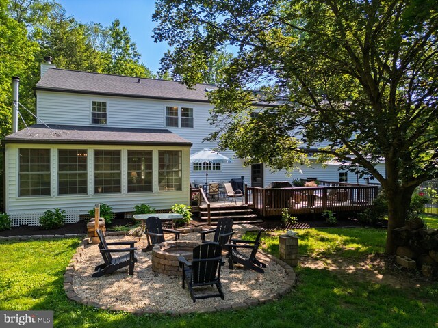 1032 N New St, West Chester, PA 19380 - back of house featuring a fire pit, a deck, and a yard