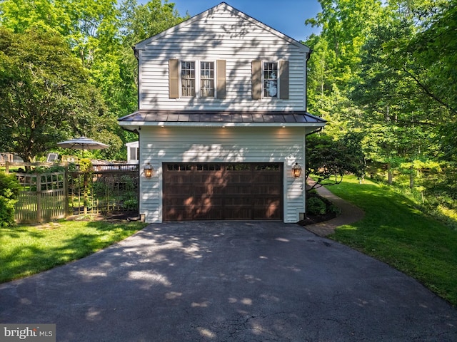 1032 N New St, West Chester, PA 19380 - view of front of property featuring a standing seam roof, an attached garage, asphalt driveway, and a metal roof