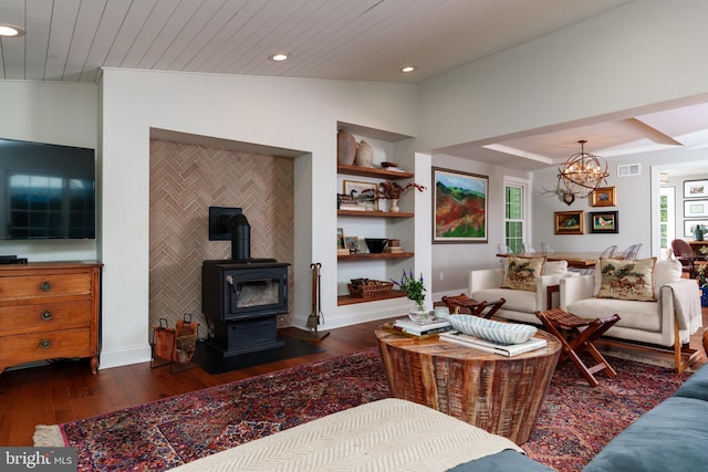 1032 N New St, West Chester, PA 19380 - living room with dark wood finished floors, a chandelier, a wood stove, recessed lighting, and wooden ceiling