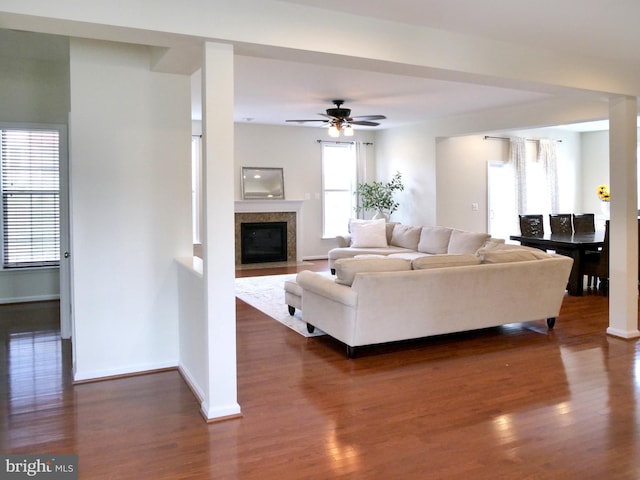 15152 Santander Dr, Gainesville, VA 20155 - living area featuring dark wood-type flooring, ceiling fan, and a fireplace with flush hearth