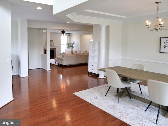 15152 Santander Dr, Gainesville, VA 20155 - dining room with a chandelier, crown molding, wood finished floors, a fireplace, and a tray ceiling