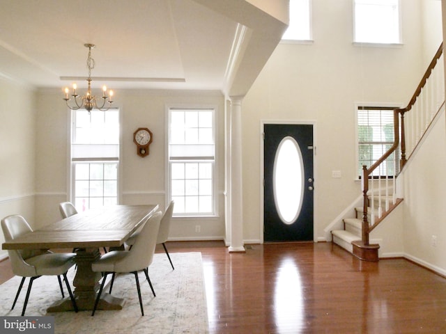 15152 Santander Dr, Gainesville, VA 20155 - entryway featuring plenty of natural light, stairs, wood finished floors, a chandelier, and ornamental molding