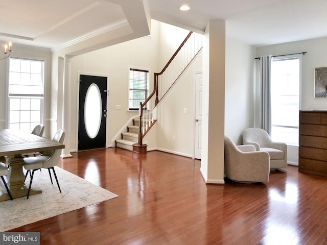15152 Santander Dr, Gainesville, VA 20155 - foyer entrance with plenty of natural light, stairs, wood finished floors, decorative columns, and recessed lighting