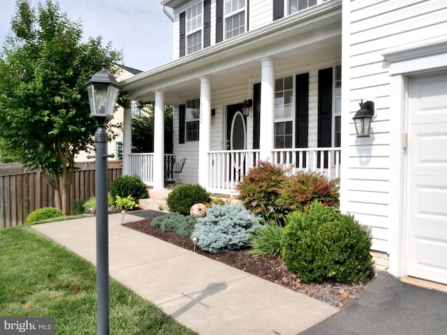 15152 Santander Dr, Gainesville, VA 20155 - property entrance featuring covered porch and a garage