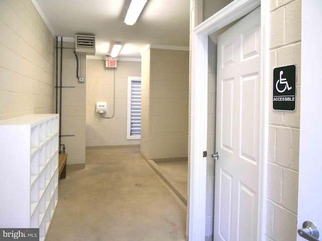 15152 Santander Dr, Gainesville, VA 20155 - hall featuring concrete flooring, concrete block wall, and ornamental molding