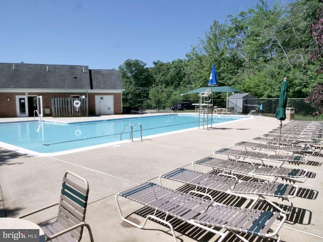 15152 Santander Dr, Gainesville, VA 20155 - community pool featuring a patio area