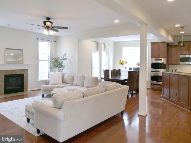 15152 Santander Dr, Gainesville, VA 20155 - living room featuring recessed lighting, dark wood-type flooring, ceiling fan, and a premium fireplace