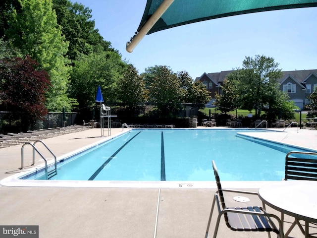 15152 Santander Dr, Gainesville, VA 20155 - community pool featuring a patio area