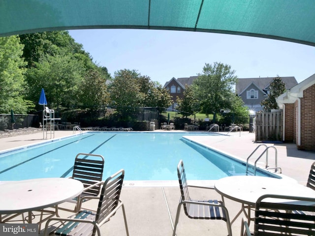 15152 Santander Dr, Gainesville, VA 20155 - community pool featuring a patio