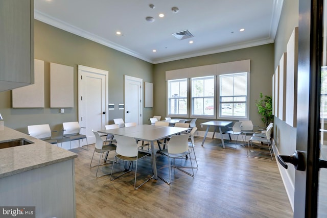 15937 Cucumber Magnolia Way, Haymarket, VA 20169 - dining room featuring crown molding, light wood-style flooring, and recessed lighting