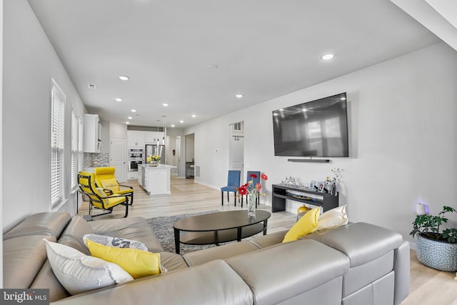 15937 Cucumber Magnolia Way, Haymarket, VA 20169 - living room featuring light wood-type flooring and recessed lighting