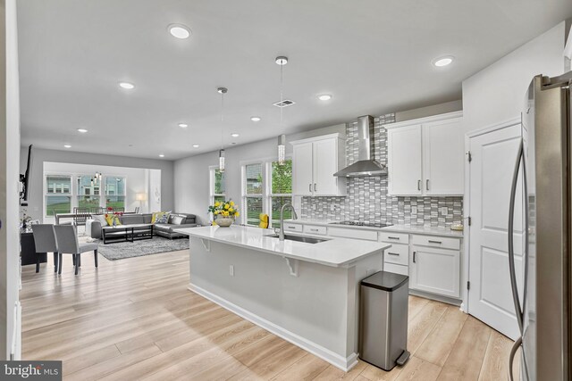 15937 Cucumber Magnolia Way, Haymarket, VA 20169 - kitchen featuring wall chimney exhaust hood, freestanding refrigerator, light countertops, white cabinetry, and recessed lighting