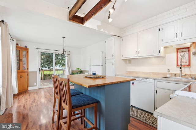 589 Wilson St, Pottstown, PA 19464 - kitchen with white appliances, white cabinets, wood finished floors, and wainscoting