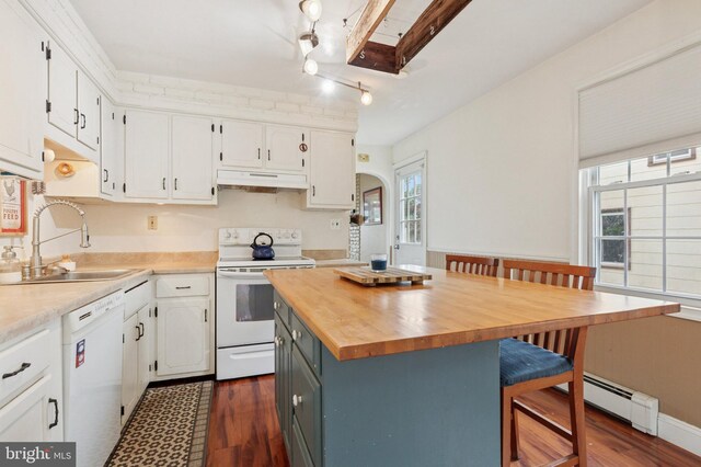 589 Wilson St, Pottstown, PA 19464 - kitchen with white appliances, under cabinet range hood, butcher block countertops, a baseboard heating unit, and white cabinets