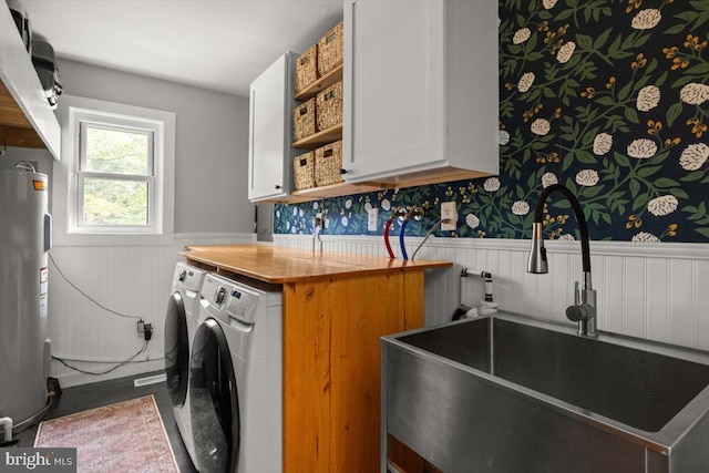 200 Sweetbriar, Winchester, VA 22603 - laundry area with wainscoting, cabinet space, electric water heater, washer and clothes dryer, and wallpapered walls