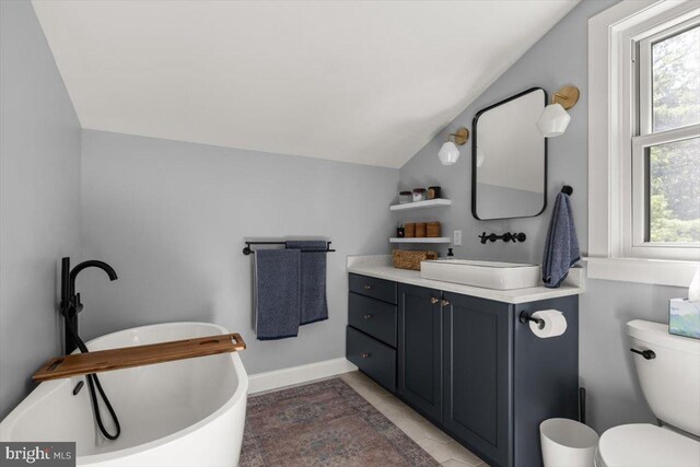 200 Sweetbriar, Winchester, VA 22603 - bathroom with lofted ceiling, vanity, and a freestanding tub
