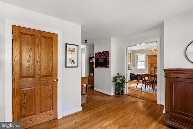 200 Sweetbriar, Winchester, VA 22603 - hall featuring a chandelier and light wood-style flooring