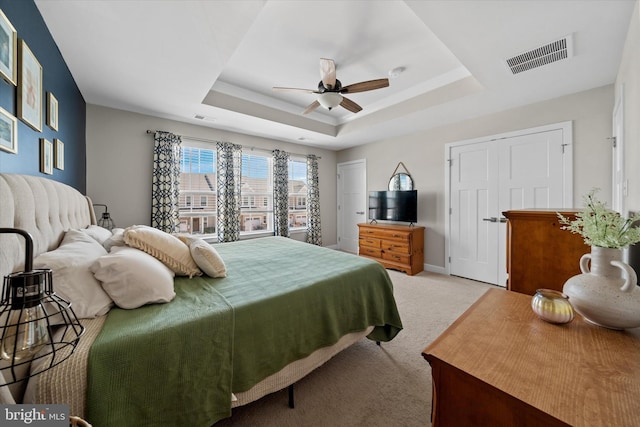 346 Goodwick Dr, Middletown, DE 19709 - bedroom featuring a tray ceiling, light colored carpet, and a ceiling fan