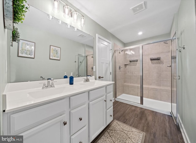 346 Goodwick Dr, Middletown, DE 19709 - full bath with a shower stall, wood finished floors, and double vanity